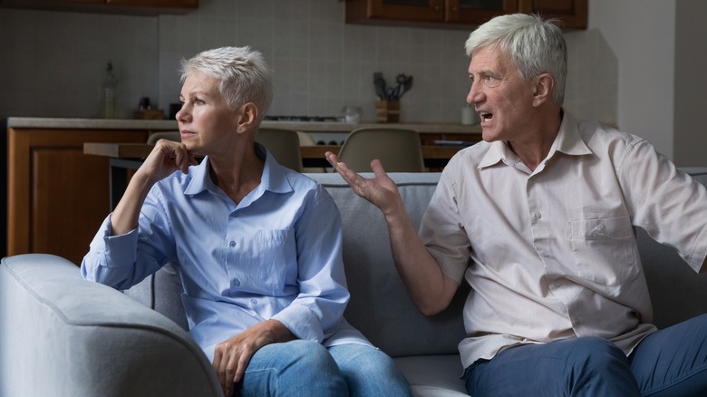 Woman ignoring angry man