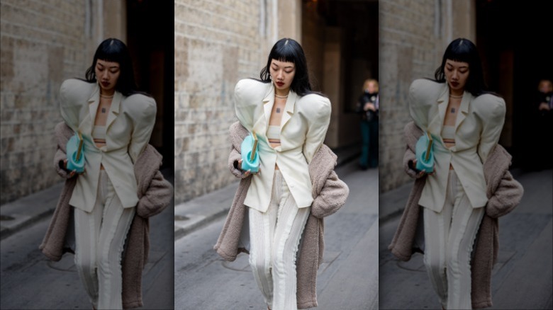 woman with jacket with strong shoulder pads