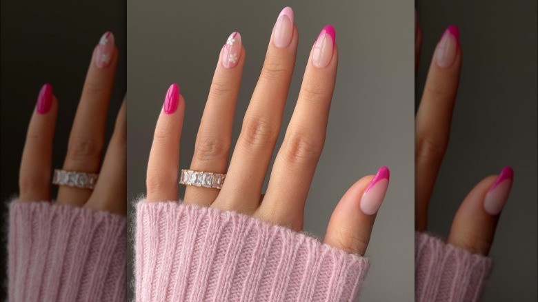 Hot pink almond nails with flower accents 