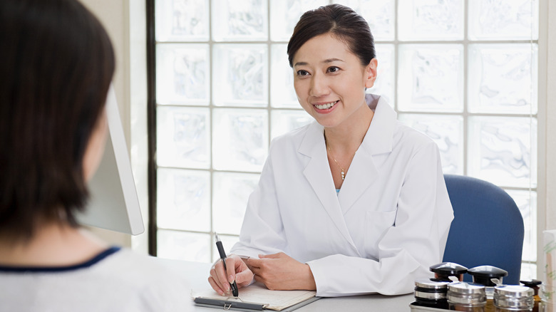 woman speaking to doctor