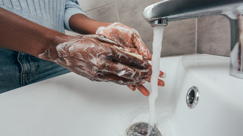 person washing hands