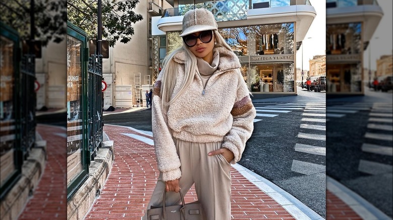 Model wearing cream teddy pullover