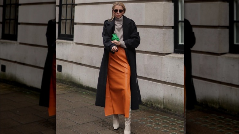 Woman wearing burnt orange maxi skirt