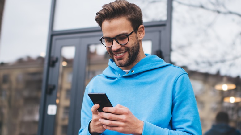 man holding cellphone