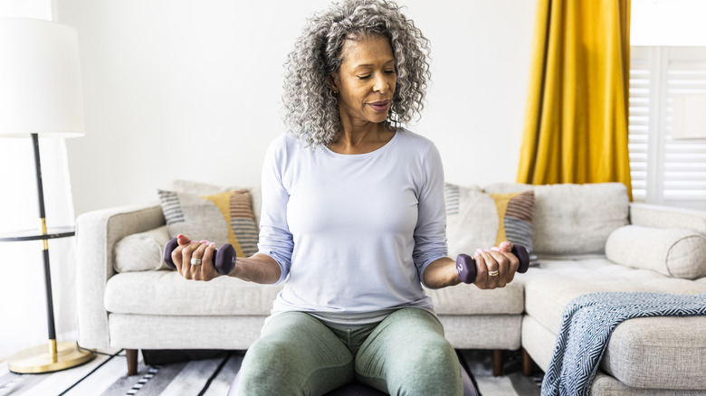 Woman exercising with dumbbells