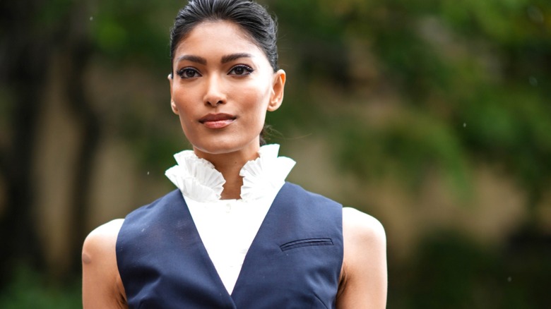 Pritika Swarup wearing vest and high-collared blouse