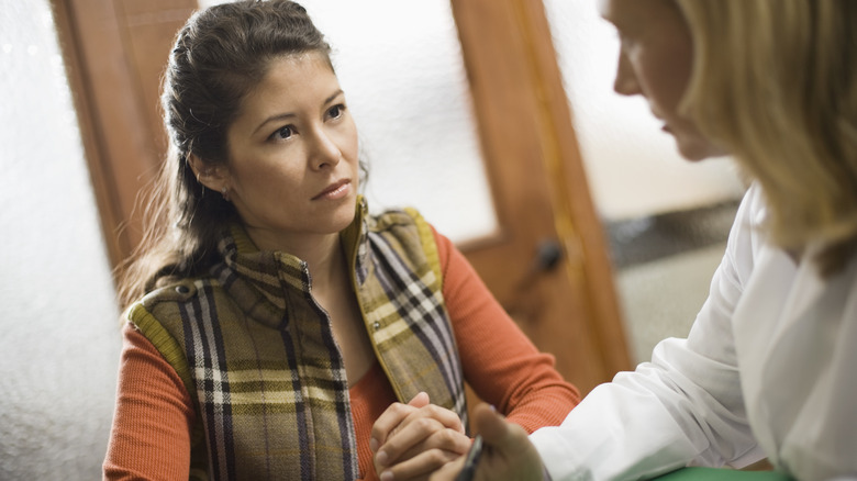 Women engage in serious conversation 