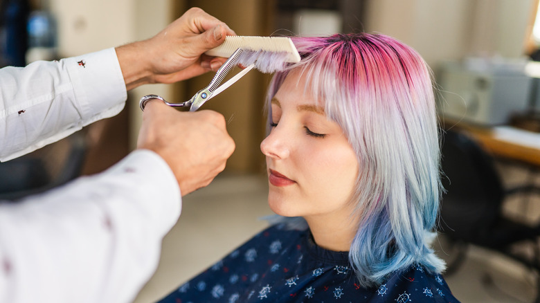 woman getting haircut