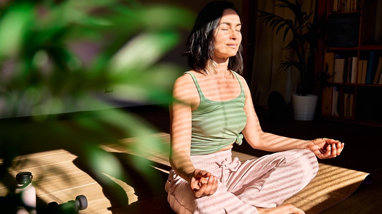 woman practicing yoga mindfulness