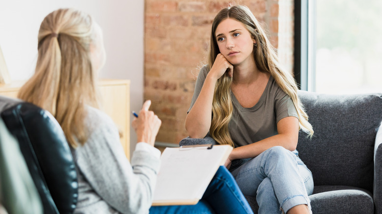 woman speaking to counselor