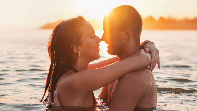 couple embracing in water