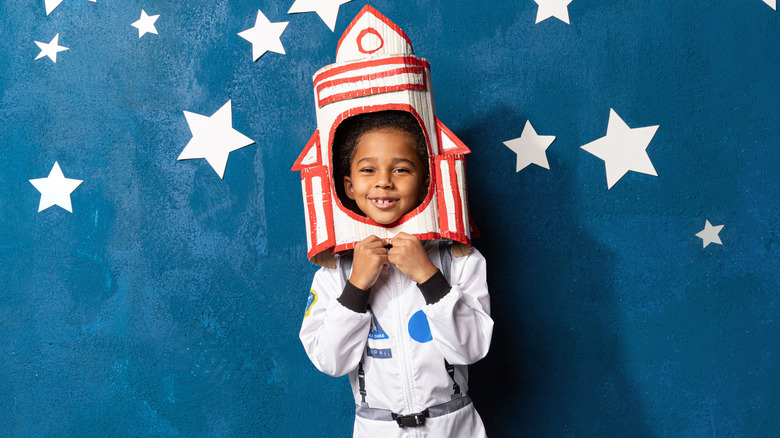 Child wearing astronaut costume
