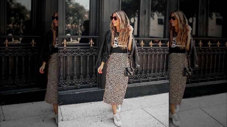 Woman wearing leopard midi skirt