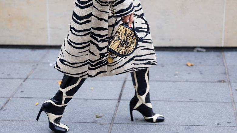woman wearing zebra coat