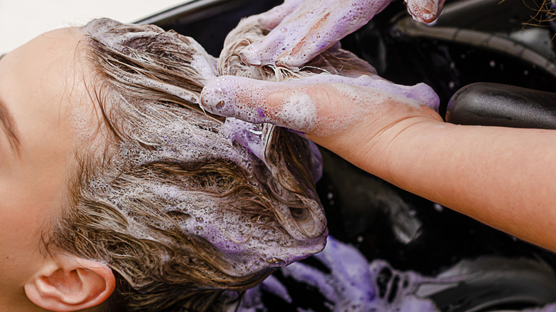 close up of woman washing hair