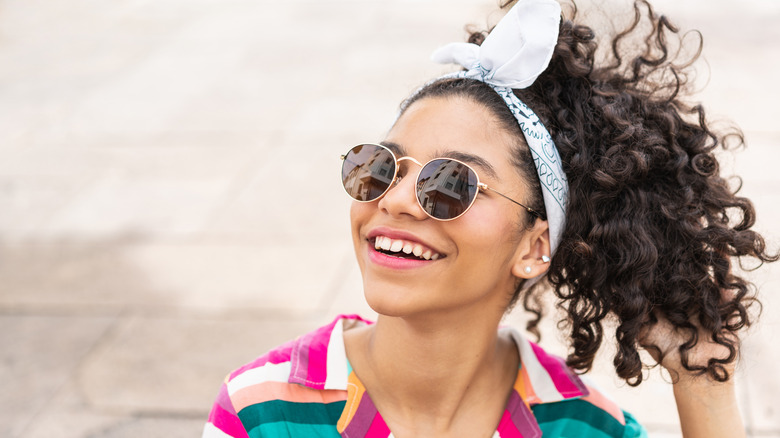 Young woman with stylish head scarf