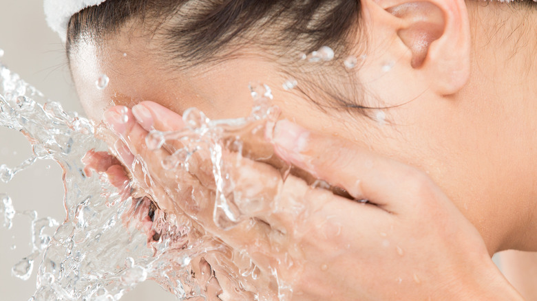 woman washing face