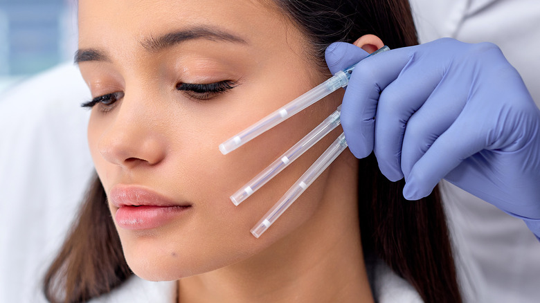 woman with PDO threads next to face