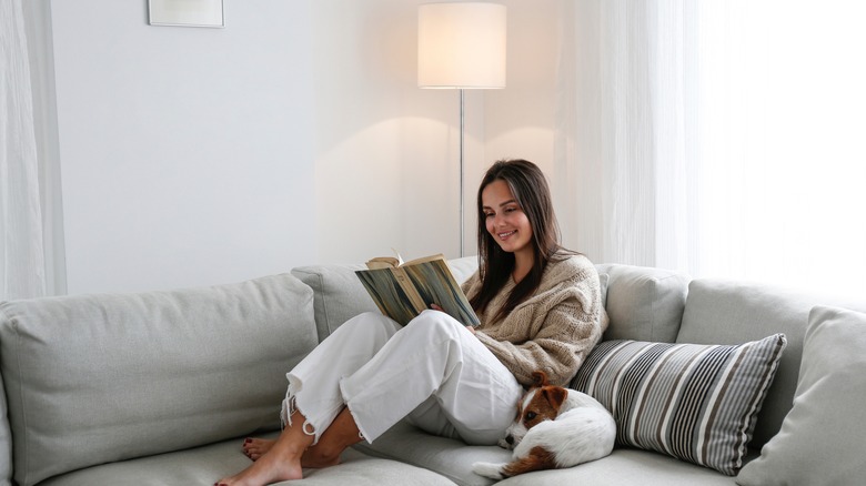 woman reading on the couch