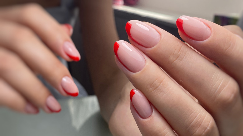 Red French manicure with negative space