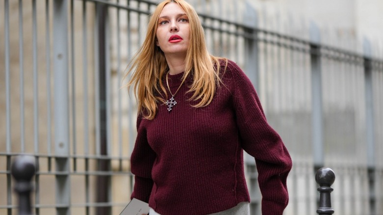 woman wearing dark red sweater