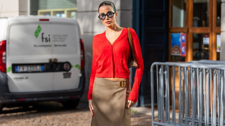 woman wearing red cardigan