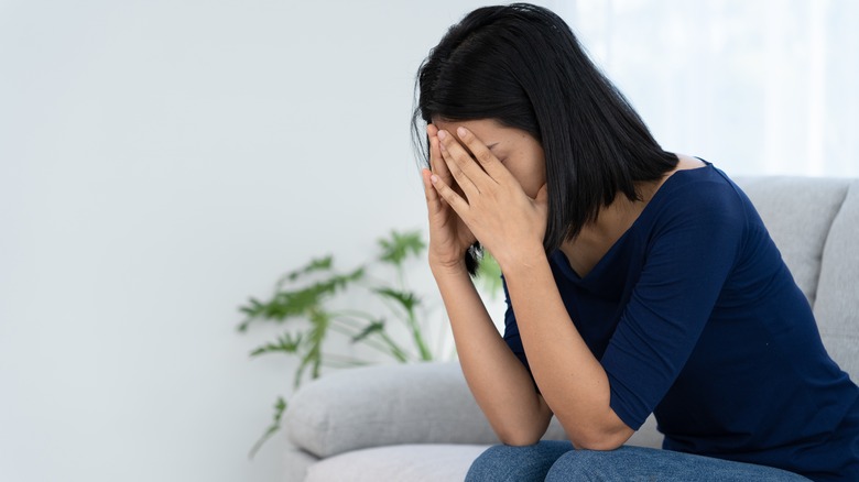 Woman sitting on the couch