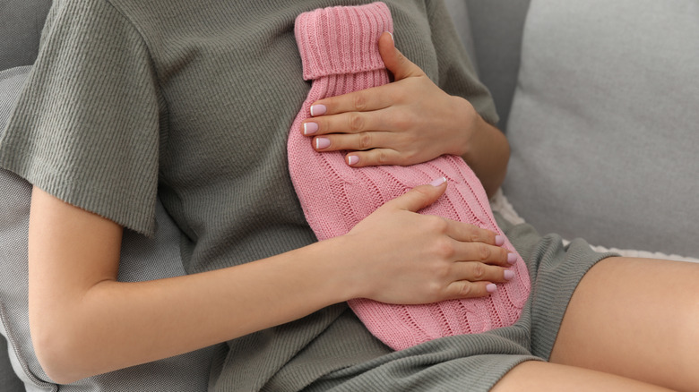 woman with heating pad