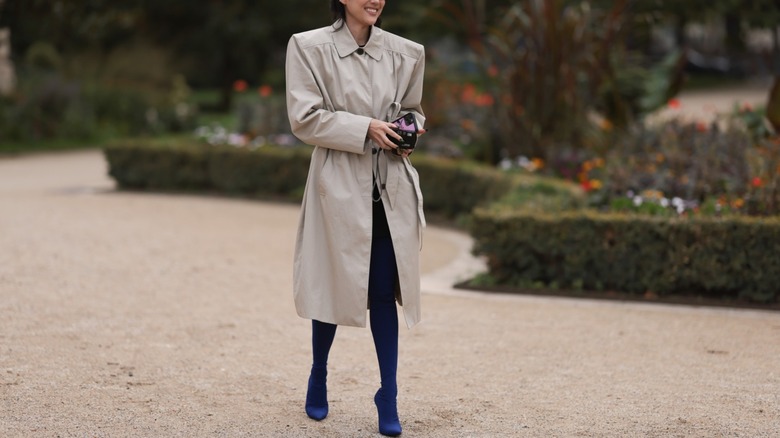 woman wearing blue over-the-knee boots