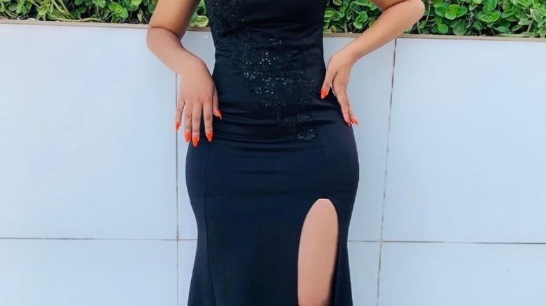 Black dress with orange nails