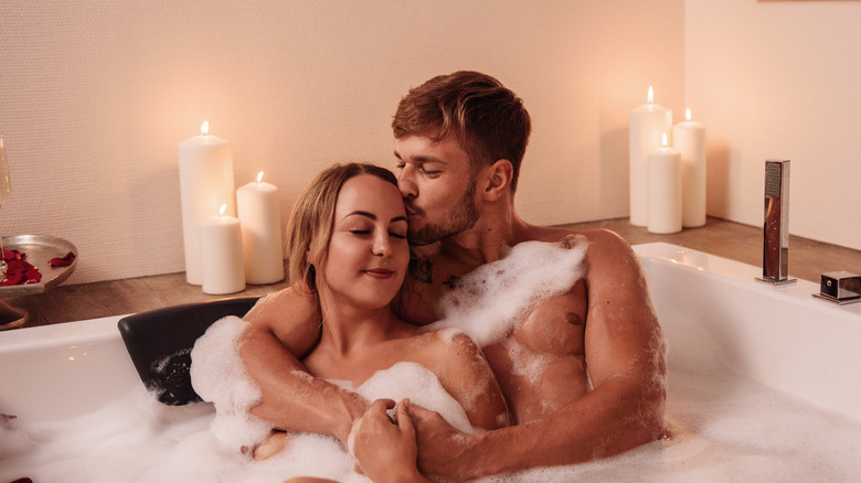 Couple taking a bubble bath