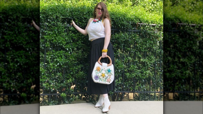 Woman modeling rosette handbag