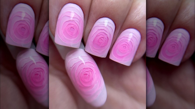 Model showing rosette inspired nails