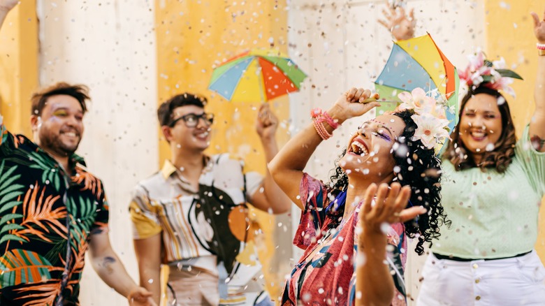 Happy people dancing and smiling