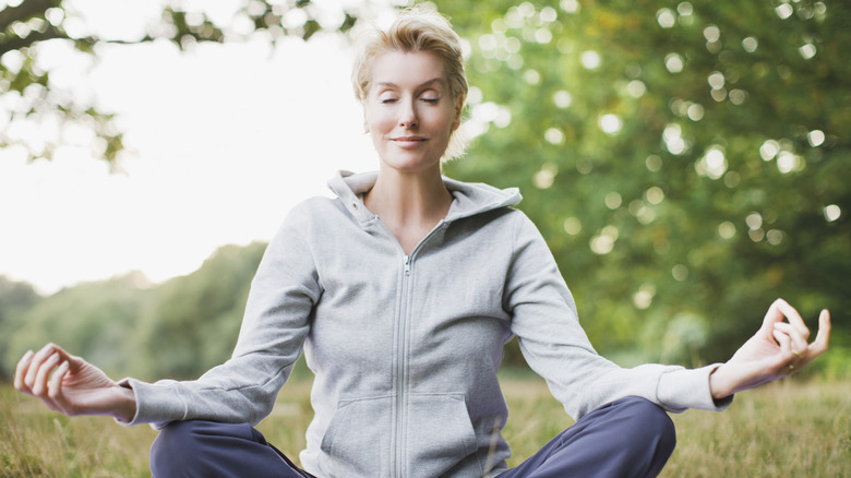 Woman meditating outside