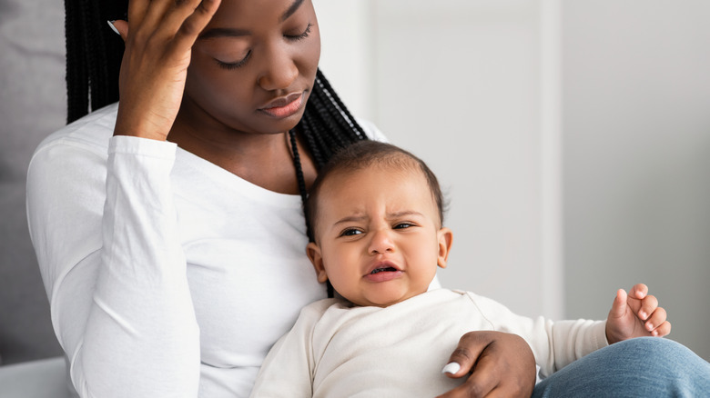 Black mother looking sad