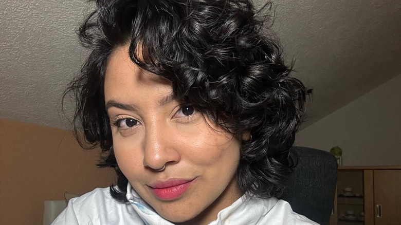 Woman with short, curly hair