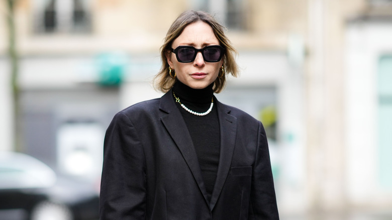 woman with an un-styled shattered bob 