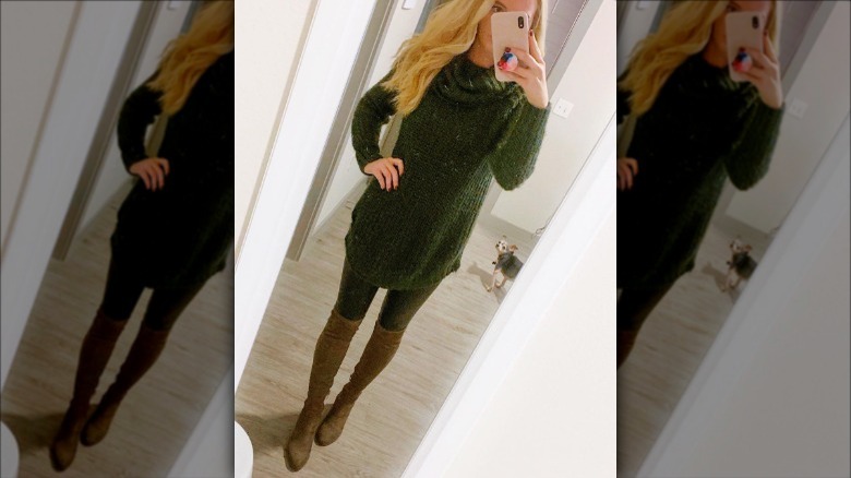 person in a sweater and boots