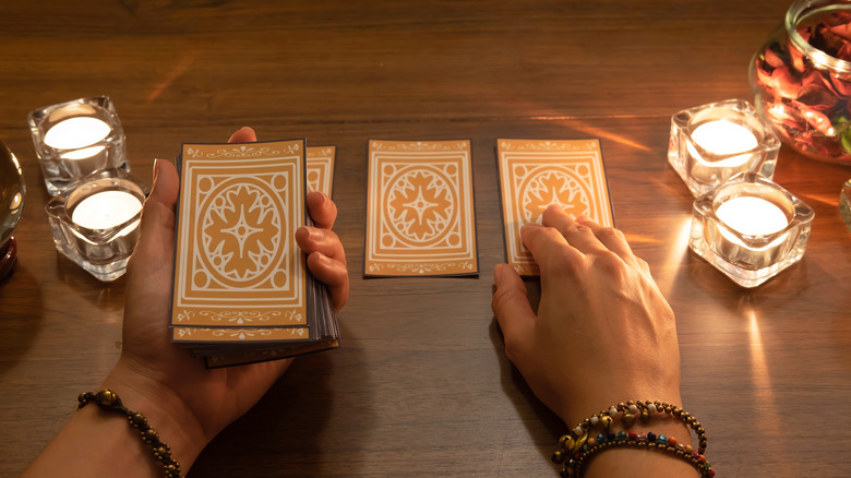 Table with candles and cards