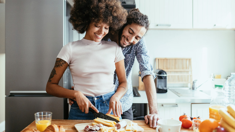 Woman and partner cooking healthy meal