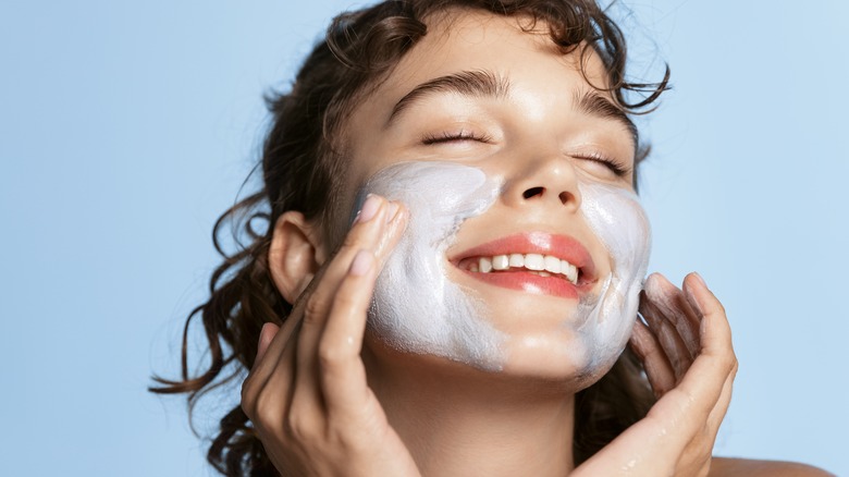 Woman washing face