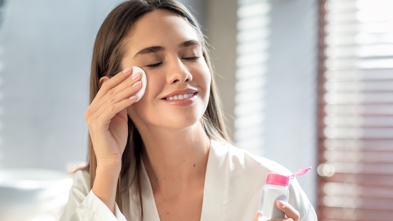 Woman using toner