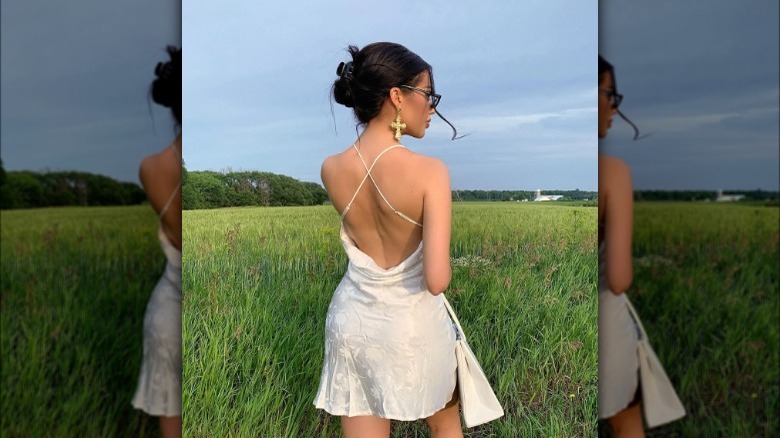 Woman wearing backless slip dress