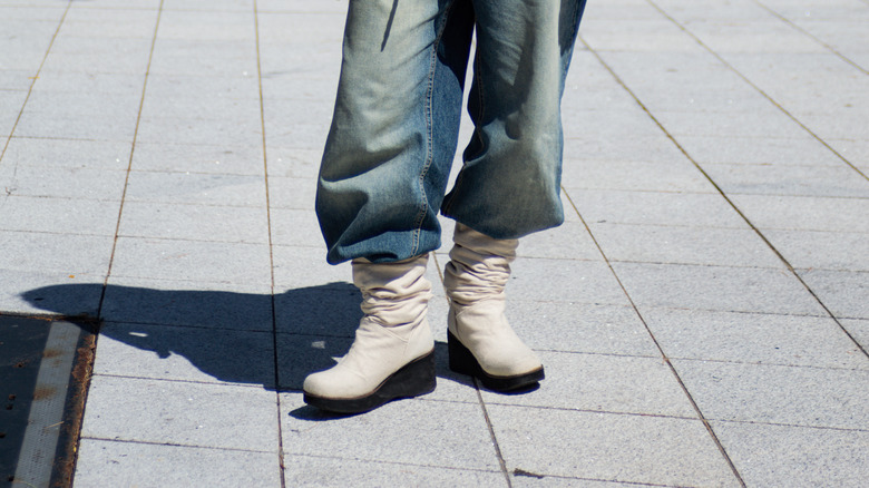 woman wearing slouchy boots