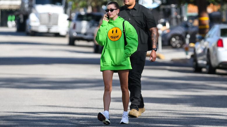 Hailey Bieber green hoodie sneakers