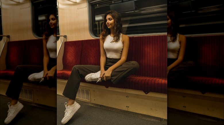 Girl wearing low-top sneakers.