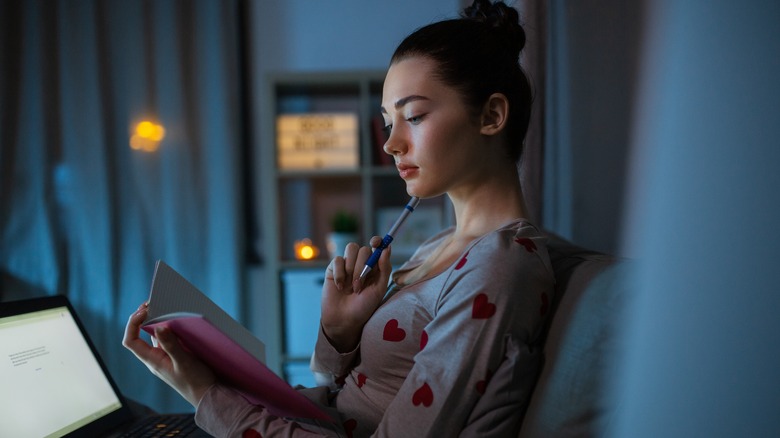 Woman journaling at night