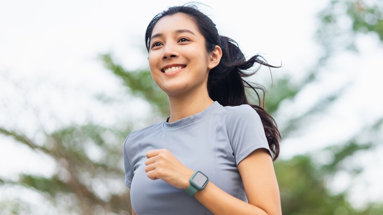 Woman jogs outdoors 