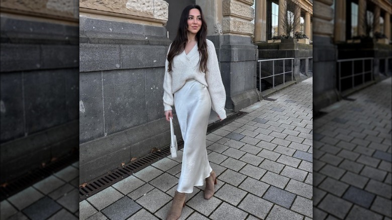 Model wearing satin midi skirt